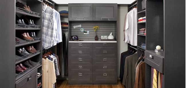 Walk in closet design for men with shoe shelves and fences and counter